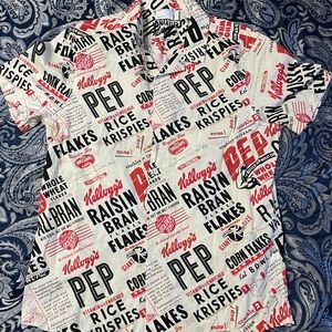 Cream, Red, and Black Kelloggs collar shirt.